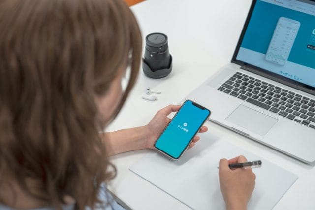 Woman designing an application while trying to keep app development costs low