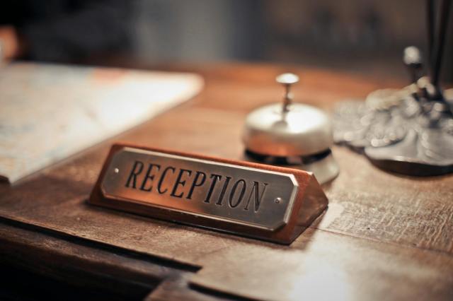 Current image: selective focus photo of reception signage